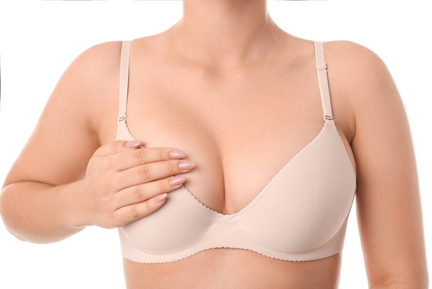 Young woman in bra on white background - Фото, зображення