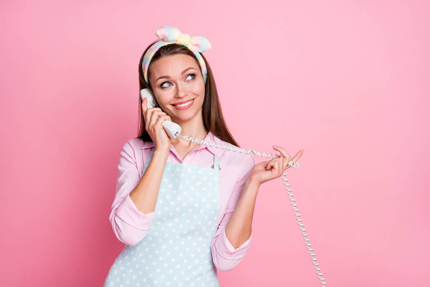 Portrait of positive cheerful girl have talk with friends use telephone wear dotted shirt isolated over pastel color background - Fotografie, Obrázek