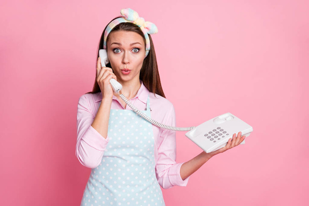 Portrait of her she nice attractive cute girlish amazed funny funky brown-haired housemaid calling contact center operator stay home quarantine health isolated over pink pastel color background - Fotoğraf, Görsel