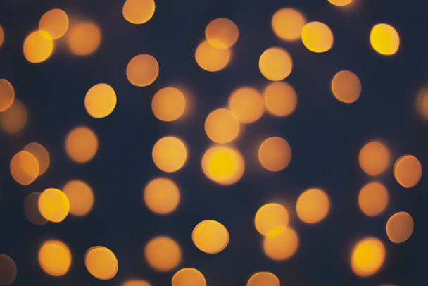 Abstract blur golden bokeh light Christmas holiday background - Zdjęcie, obraz