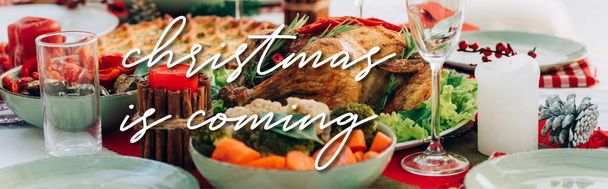 table served with delicious pie, roasted turkey and vegetables near christmas is coming lettering near candles, banner - Foto, immagini