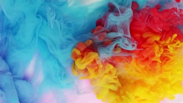 Ink in water exploding mixing in slow Motion. Paint splash swirling underwater. Colorful clouds, abstract color smoke dynamic flow - Footage, Video