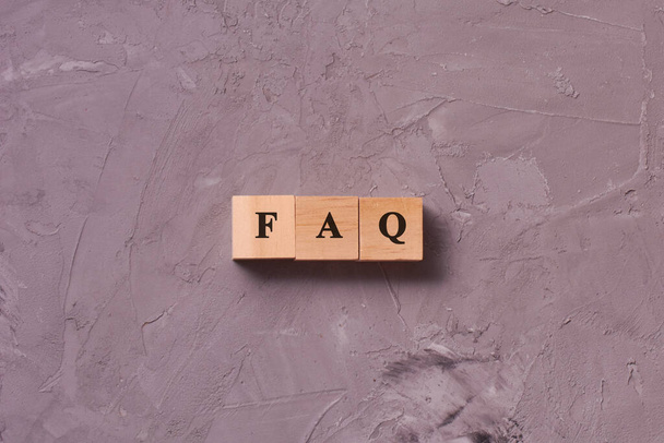 Wooden blocks with word FAQ on concrete background. Frequency asked questions, Answer, Information, Communication and Brainstorming Concepts - Zdjęcie, obraz