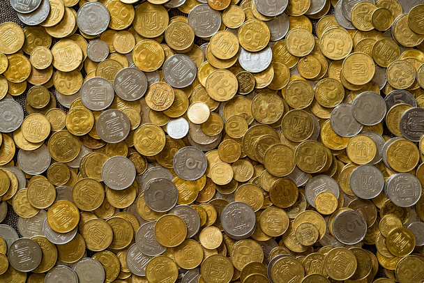 Plenty of golden and silver coins. Copper coins, quarters, nickels. Money, financial coins and economy. - Photo, Image