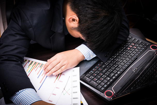 Exhausted and tired businessman sleeping in office - Photo, Image