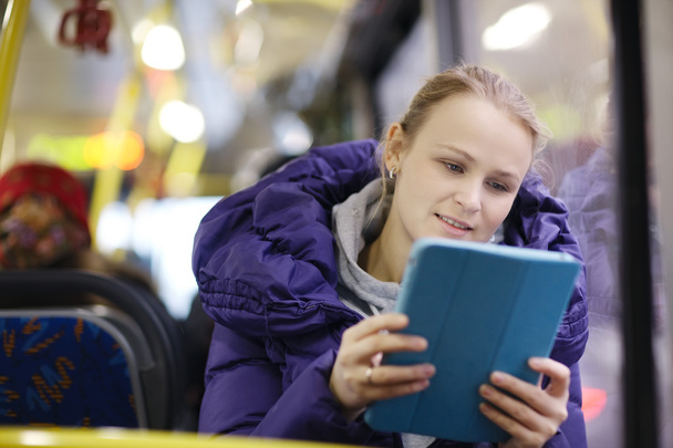 Woman with touchpad in the bus - Zdjęcie, obraz