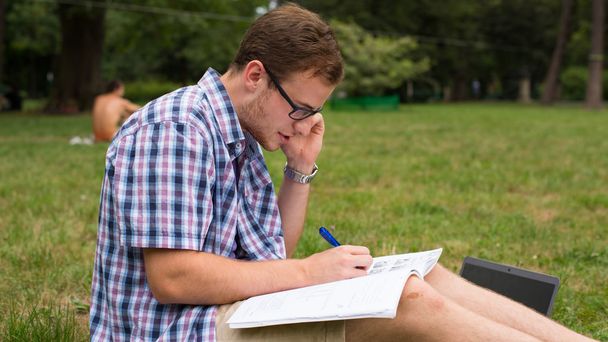 Studying outdoors with notebook - Foto, imagen