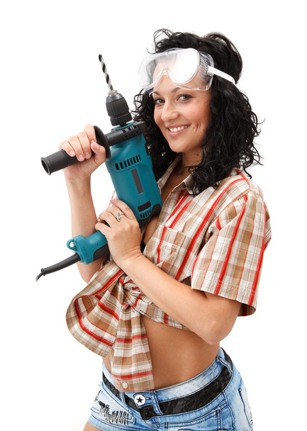 Girl with drilling machine - Foto, Imagen