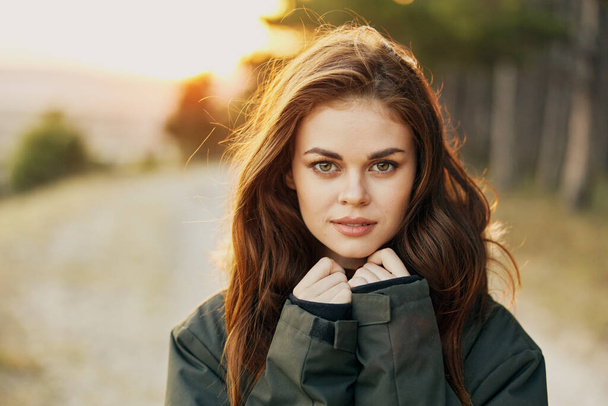 woman warm jackets attractive look close-up outdoors nature - Foto, afbeelding
