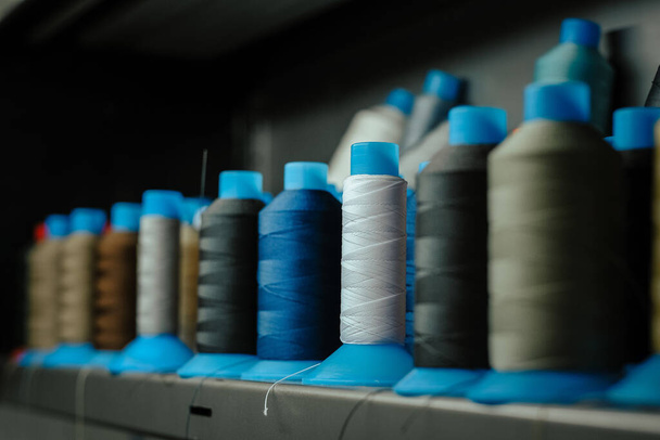 A closeup shot of rolls of sewing machine thread - Zdjęcie, obraz