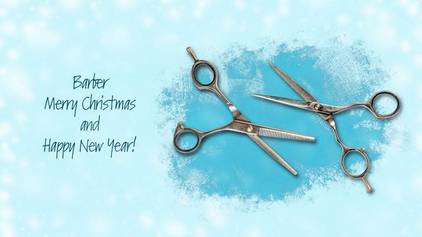 Hairdressing scissors on a blue background. Barber Merry Christmas and Happy New Year Concept. Festive background. - Photo, Image