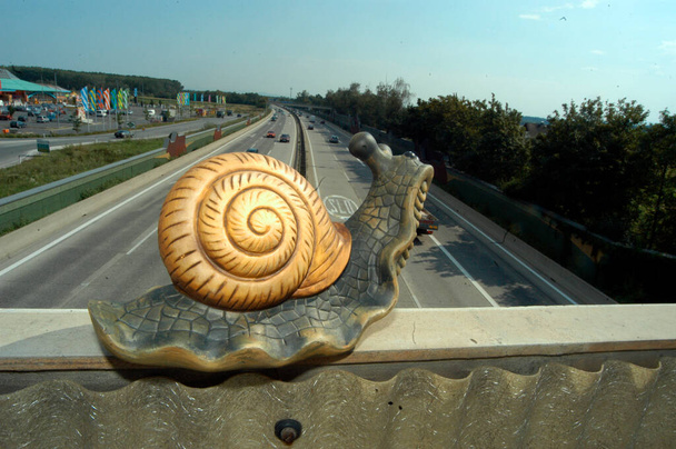 driving with snail pace on the highway, speed limit on the road - Photo, Image