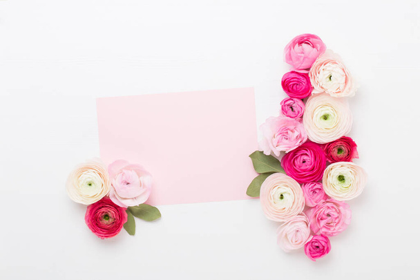 Beautiful colored ranunculus flowers on a white background. Valentines day greeting card. - Foto, Imagem