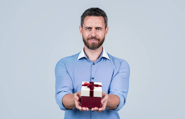 Happy birthday to you. Handsome man give birthday present. Anniversary celebration. Holiday greetings. Gift shop. Occasion makes special - Photo, Image