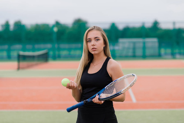 Tennis tournament. Female player at clay tennis court - Foto, Imagem