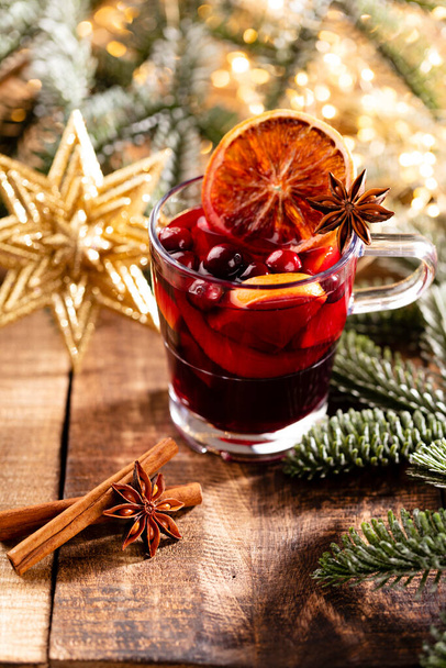 Christmas mulled wine with spices on a wooden rustic table. - 写真・画像