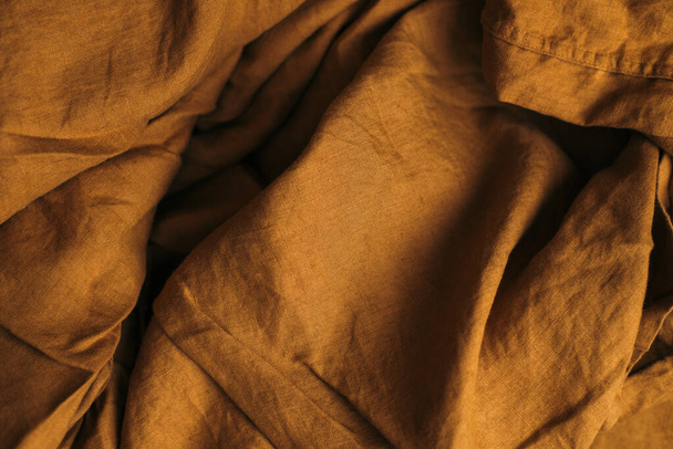 brown pleated linen fabric. view from above. space for text. - Фото, изображение