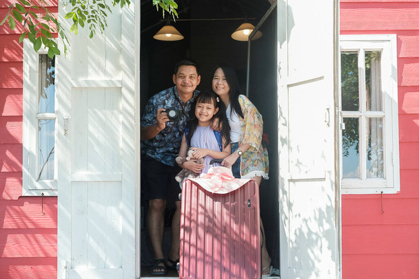 Asian family traveling and  standing in a resort hotel with smile and happy - Fotoğraf, Görsel