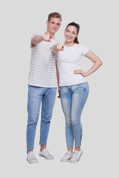Couple Pointing to Camera Standing Isolated. Man and Woman Pointing, Lovers, Friends, Couple Concept. Sign - Foto, imagen