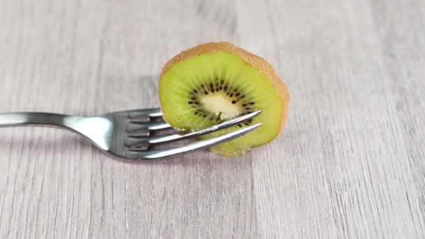 composition with kiwi on wooden table - Footage, Video