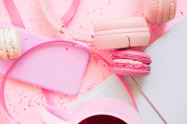 Girls pretty pastel set with planner, tea, macaroon and headphones. Flat lay  - Photo, Image