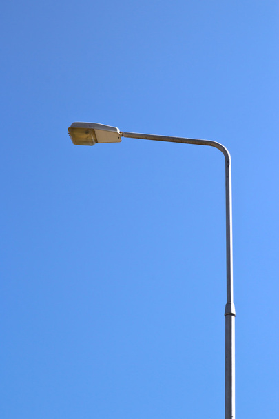 Streetlight isolated on blue sky - Фото, зображення