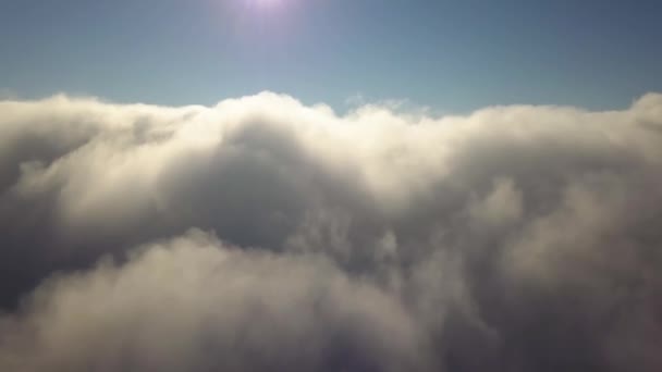 Aerial view from above of white puffy clouds in bright sunny day. - Footage, Video