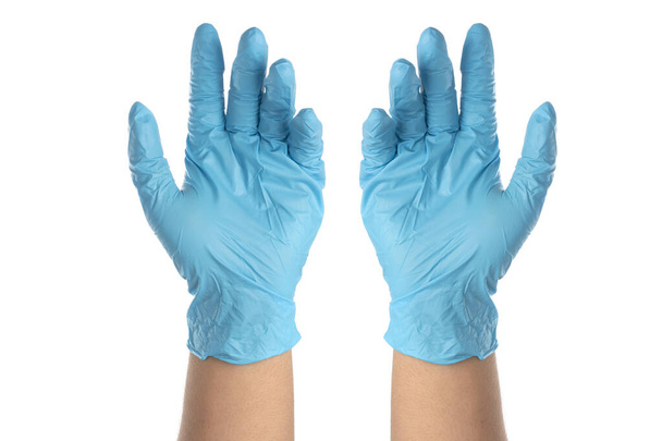 Les médecins portent des gants en caoutchouc nitrile bleu séparément sur un fond blanc. - Photo, image