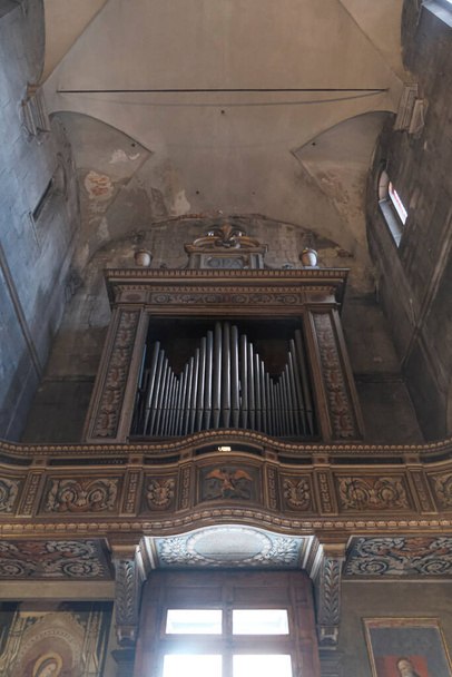 The organ in the central nave of the Church of San Michele in Foro in Lucca, Italy. High quality photo - Photo, Image