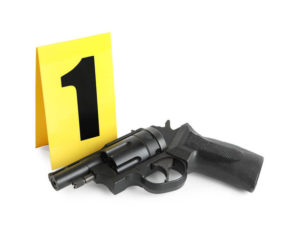Gun and crime scene marker with number one isolated on white - Фото, зображення