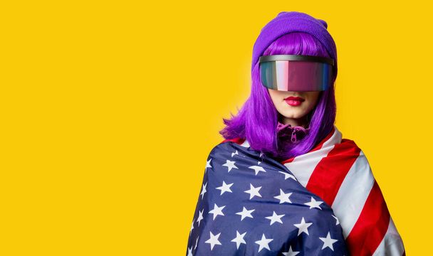 Style woman in VR glasses and 80s tracksuit with USA flag on yellow background - Photo, Image