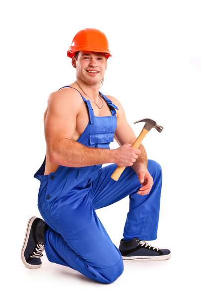 Portret van sexy mechanic met een hamer - Foto, afbeelding