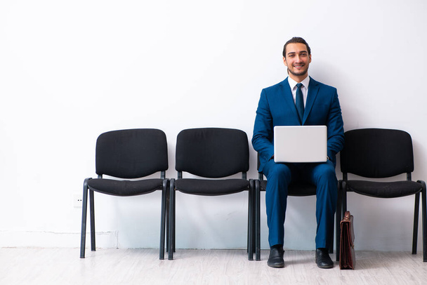 Young businessman waiting for an interview at hall - Photo, Image