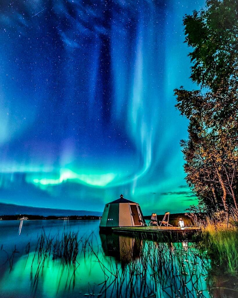 Multicoloured green, blue vibrant aurora borealis Polaris, Northern lights in night sky. - Photo, Image