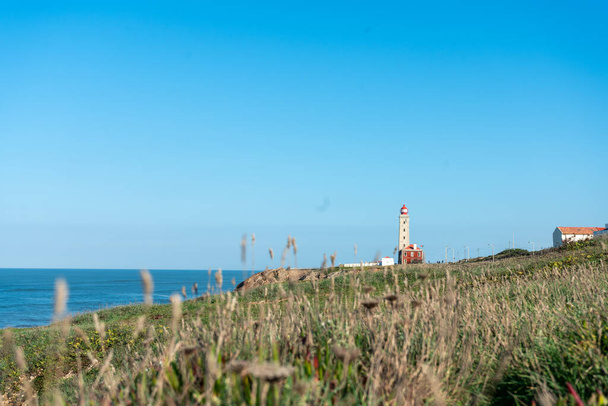 view of the lighthouse on the coast of Sao Pedro de Moel in portugal - Photo, Image