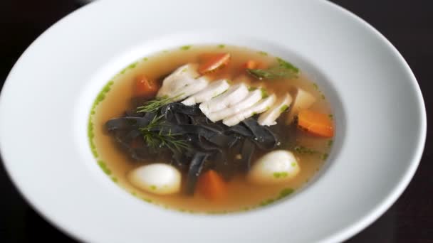 Vegetable soup with quail eggs and herbs - Footage, Video