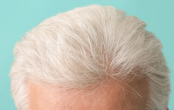 Senior man with grey hair on color background, closeup - Photo, Image