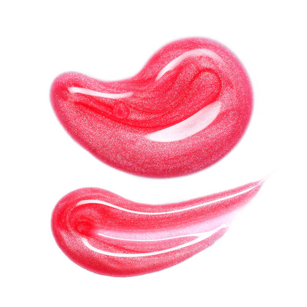 Mancha de brillo labial aislada en blanco. Muestra de producto de maquillaje manchado rosa - Foto, Imagen