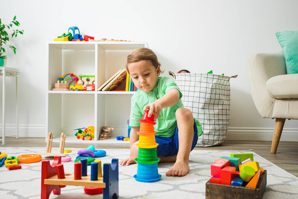 Child having good time at home or daycare. - Fotografie, Obrázek