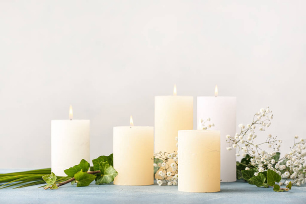 Beautiful aroma candles on table in room - Foto, Imagen