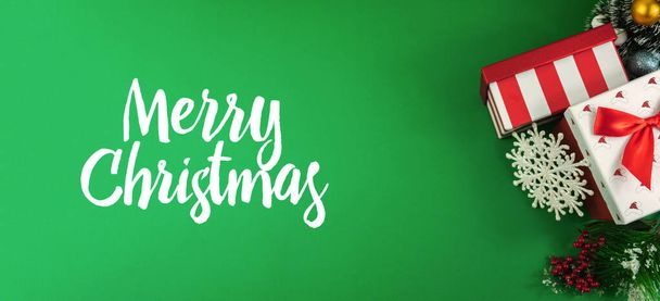 Christmas backgrounds with decorations on green, place for text and beautiful inscriptions, coziness and atmosphere - Photo, Image