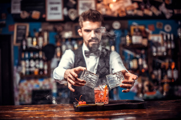 Barman mixes a cocktail in the beerhall - Photo, Image