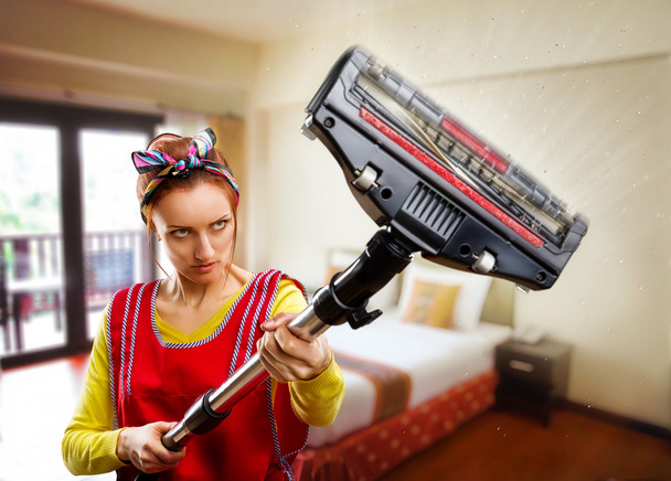 Portrait of housewife with vacuum cleaner - Photo, Image