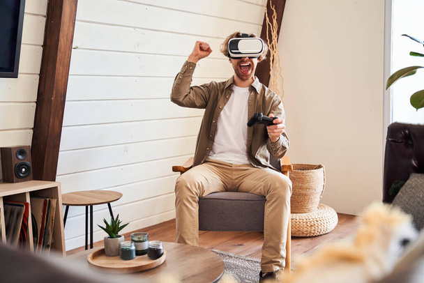 Man having fun with virtual reality headset - Фото, изображение