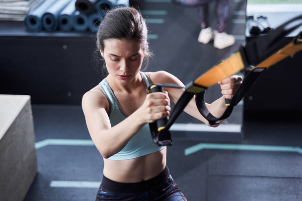 Lady exercising her muscles sling - Fotó, kép