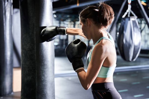 Woman actively training in the gym - Photo, image