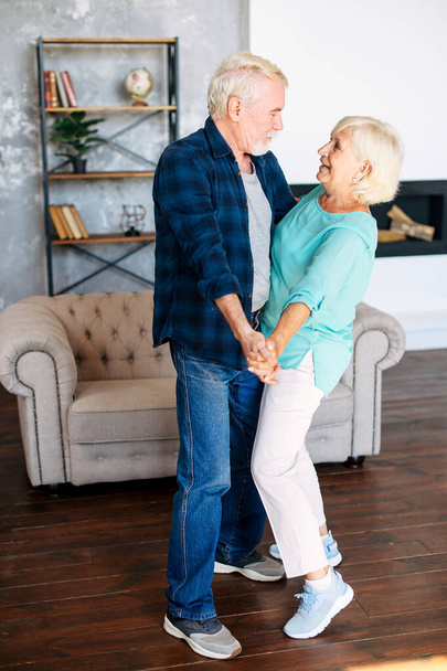 Romantic modern senior couple hagging indoors - Photo, Image