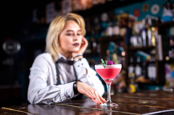 Girl barman makes a cocktail at the beerhall - Photo, Image