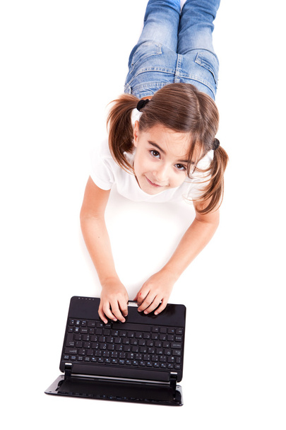 Little student girl with a laptop - Foto, Imagen