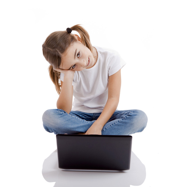 Little student girl with a laptop - Photo, Image